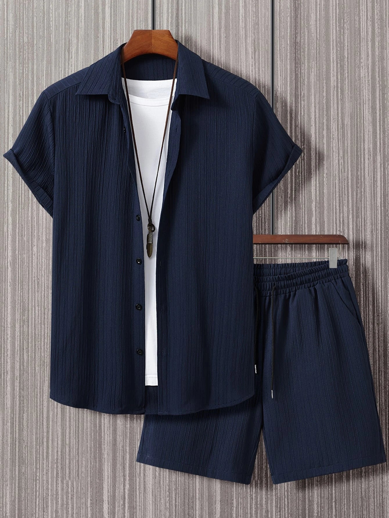 Men's suit (shirt and trousers) with a comfortable fit and simple design, featuring half buttons, suitable for summer.