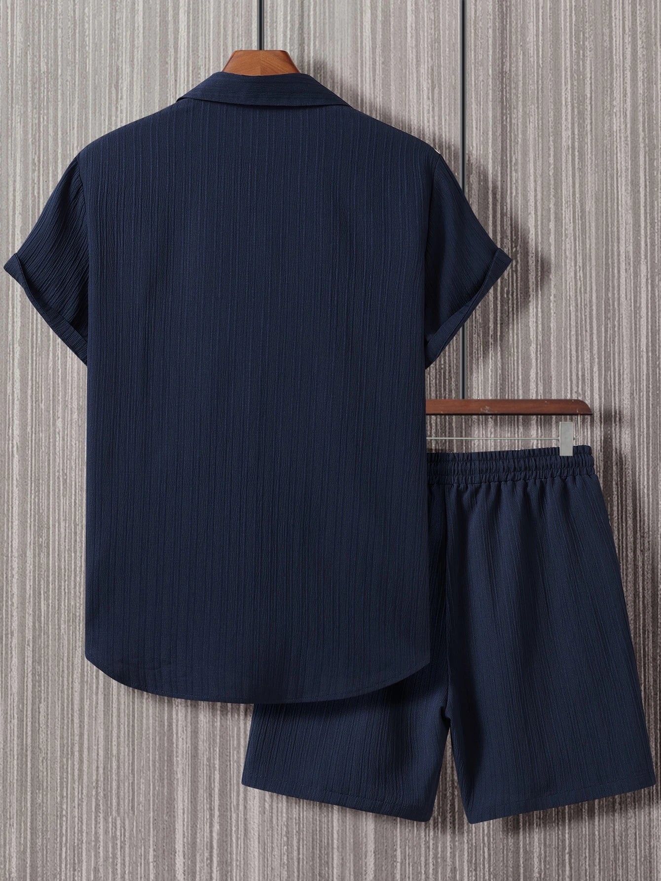 Men's suit (shirt and trousers) with a comfortable fit and simple design, featuring half buttons, suitable for summer.