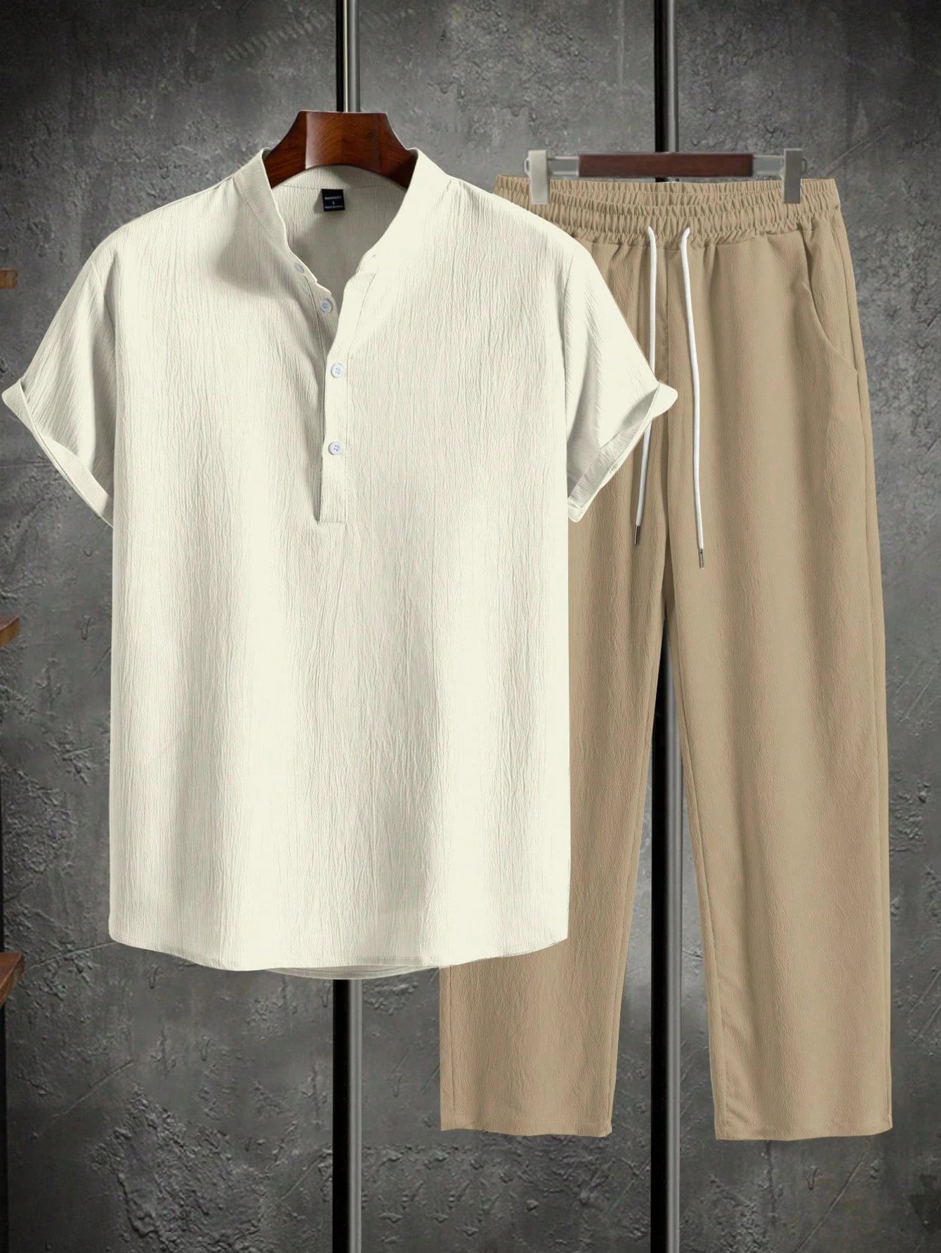 Men’s suit (shirt and trousers) with a relaxed fit and simple design featuring half buttons, suitable for summer.