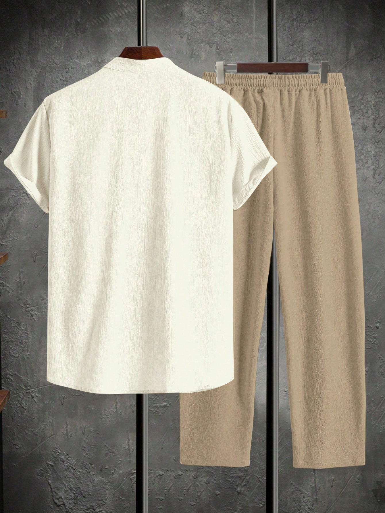 Men’s suit (shirt and trousers) with a relaxed fit and simple design featuring half buttons, suitable for summer.