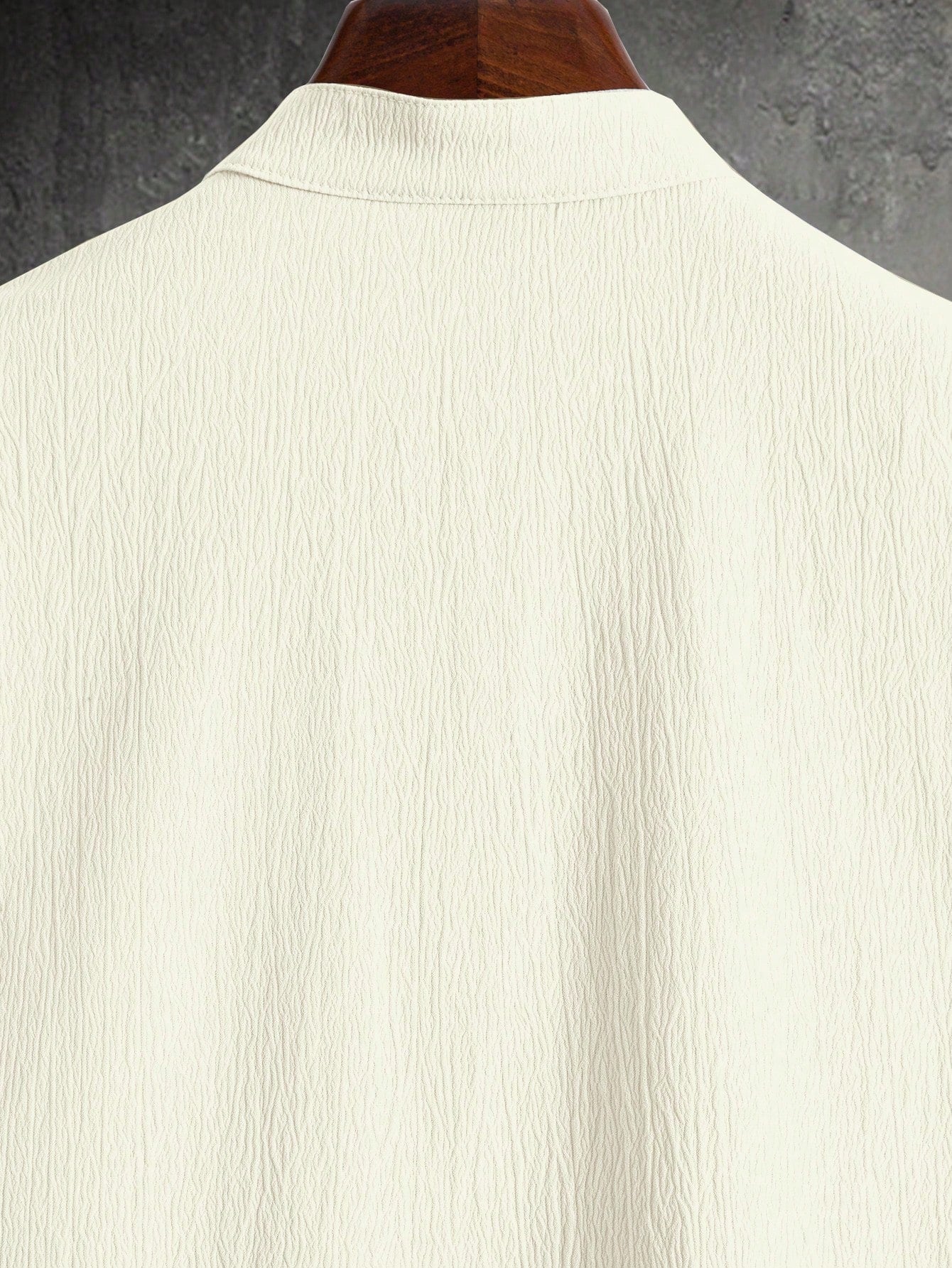 Men’s suit (shirt and trousers) with a relaxed fit and simple design featuring half buttons, suitable for summer.